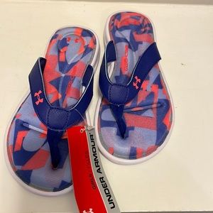 Little girl’s Under Armour flip flops. New with tags